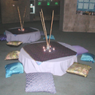 The seating areas were stocked with oversize pillows, candles, and bamboo.