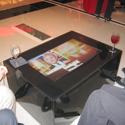 EventStyle created sleek black coffee tables with TVs embedded inside.