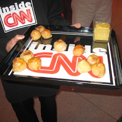 The hors d'oeuvres were served on trays printed with the red, black, and white Inside CNN logo.