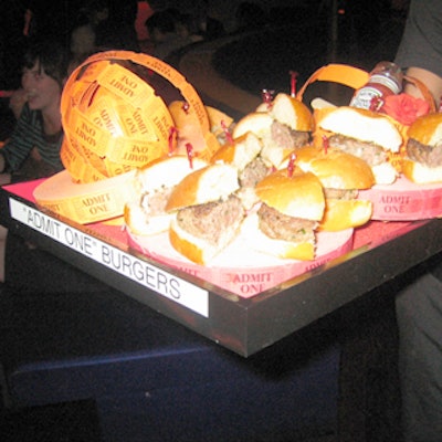 Caterer Gourmet Gal's menu included mini burgers filled with herbs and Canadian cheddar on brioche buns presented on tiers of orange ticket rounds.