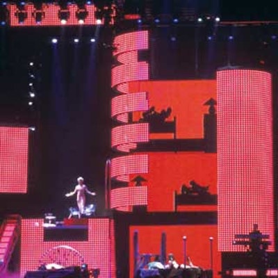 Britney Spears' 2004 concert tour set included custom-built lifts, platforms, stairs, props, and support structures by All Access Staging & Productions. The giant video screen—a big stage design trend—were provided by XL Video.