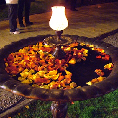 Flower petals adorned food stations, bars, fountains, and a stone wishing well.