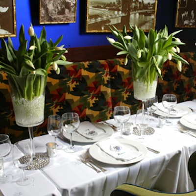 Maria McBride's elegant arrangements of white tulips were set in large pedestal vases.