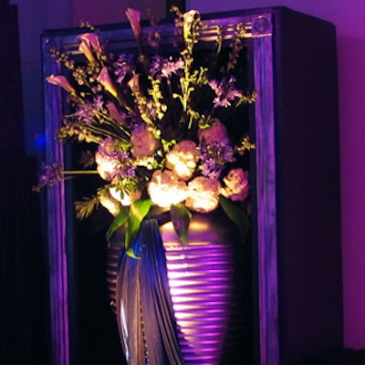 Tall box enclosures displayed lush florals in the dining space.