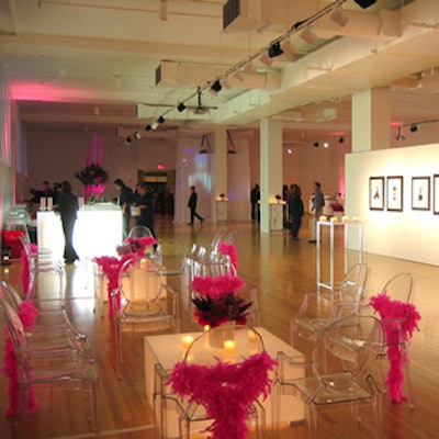 Pink feather boas shrouded Signature Rentals' ghost chairs.