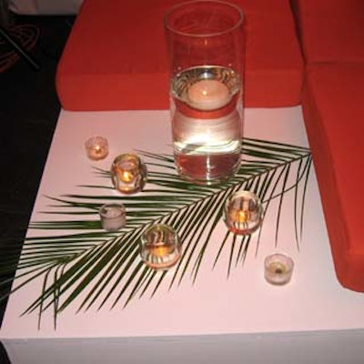 Event Source International used palm fronds and floating candles as part of the decor.