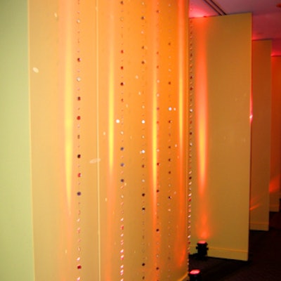 Strings of mirrored beads lined the walls.