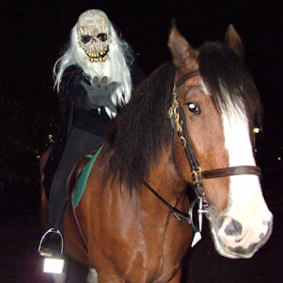 Elaborately garbed performers on pedestals and on horseback greeted guests as they approached the Stamford party tents at Rumsey Playfield in the park.