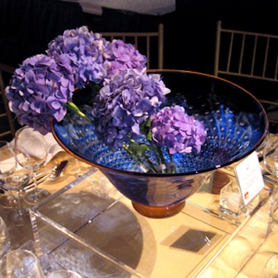 A bunch of purple hydrangea in a glass bowl made for a unique centerpiece at the Museum of Arts & Design’s Visionaries gala.