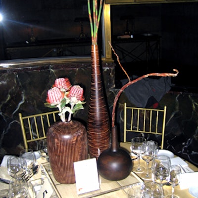Different sizes of dark vases were grouped together for an exotic feel.