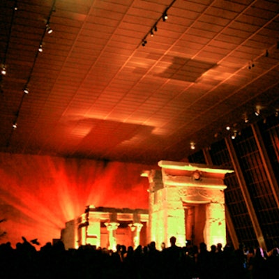 At the Metropolitan Museum of Art's 'Glamour on the Nile' benefit, Frost bathed the Temple of Dendur in fiery red and orange lighting.