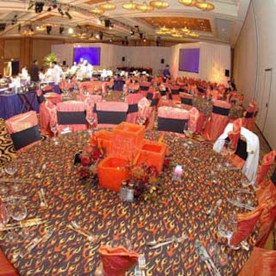 Panache Party Rentals dressed tables in flame-patterned linens and Event Management Group created centerpieces with a festive atmosphere for the South Florida Meeting Professionals International's 2004 Chefs' Challenge