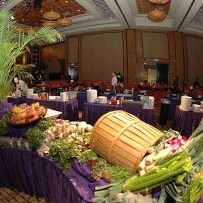 Baskets and mounds of fresh produce and other ingredients covered tables that ran the length of the ballroom.