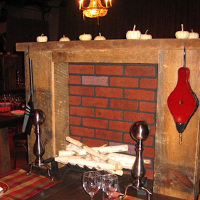 Different table runners, china, and miniature faux fireplaces that divided long banquet tables in half, were used to make the dinner less formal and more like a family gathering.
