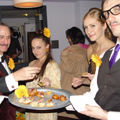 Twiggy-esque female caterwaiters and male caterwaiters dressed like Peter Sellers served hors d'oeuvres. A David Niven look-alike was also in attendance.