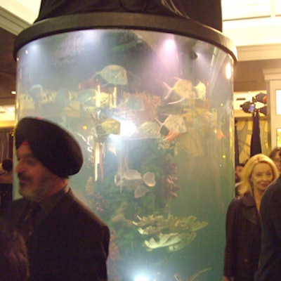The hotel lobby’s unique decor includes a large curved aquarium.