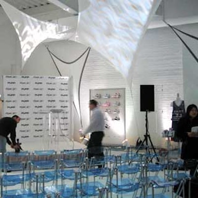 Fandango Special Events transformed a first-floor room inside Splashlight Studios into a press conference area for the launch of Reebok's Pump 2.0 shoe with rows of blue acrylic folding chairs from Studio 22 in front of a small stage.