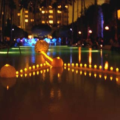 Assorted white flowers were connected by a string of electric lights, creating a candle effect in the pool at the Delano hotel for the preshow opening party on November 30.