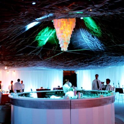 At Spago for the Closer premiere, Benarroch Productions made the ceiling appear to glow with a tightly stretched canvas and colorful lighting.