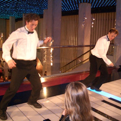 Caterwaiters from RCano Events played on a giant keyboard at the FAO Schwarz store reopening party.