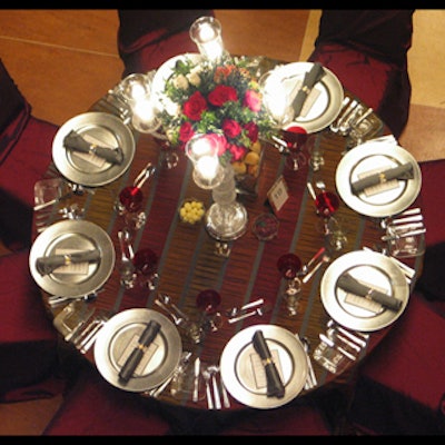 Dining tables were elegant and treated with crystal chandeliers and burgundy undertones.