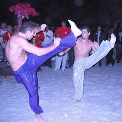 Skindo Brazil Show performed capoeira for the crowd at the Greater Miami Convention & Visitors Bureau and Miami Beach Chamber of Commerce holiday soiree at Nikki Beach.