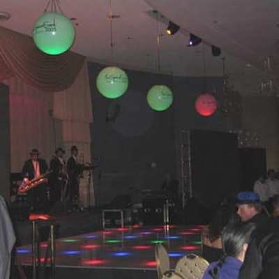 In the supper club, Nestor Torres and his band played on a lit stage by Ice Magic.