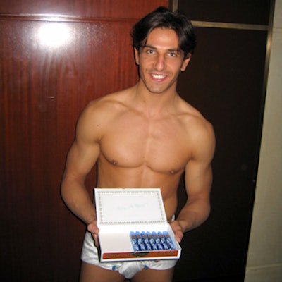 Male models in white satin diapers offered candy cigars at the launch party for Preston Bailey’s new book, Fantasy Weddings.