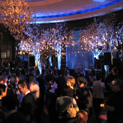 Large branches festooned with hundreds of white hanging lanterns decorated the stage in front of the Rainbow Room’s famed rotating dance floor.