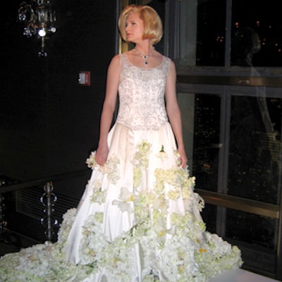 Drag queen Brini Maxwell, who usually favors Donna Reed-style frocks, posed in a Reem Acra dress Bailey decorated with flowers.