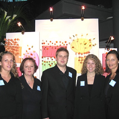 Emily Ryan, Dale Jones, Phil Greenen, Meredith Smith, and Andrea Koronovich, event planners from Pipeline Communications, posed in front of one of the vertical food stations.