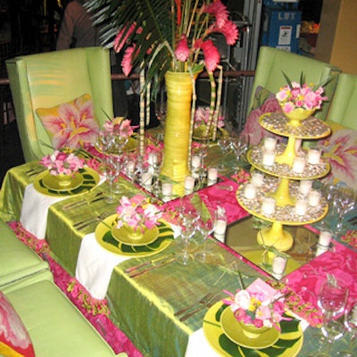 For Annie Selke Companies' Pine Cone Hill and Potluck Studios' cozy table, the green tablecloth complimented the quilted red underlay and long napkins were edged in green and red ribbon. Vintage-looking touches like the floral patterned rug matched the throw pillows on the pale green leather chairs.