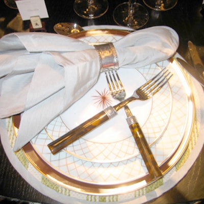 Catherine Kiel of Eric Cohler Inc. placed tortoise-handled forks in a crisscross configuration on top of the plates at her table designed for the Greystone Home Collection, a line of textiles, furniture, and home accessories.