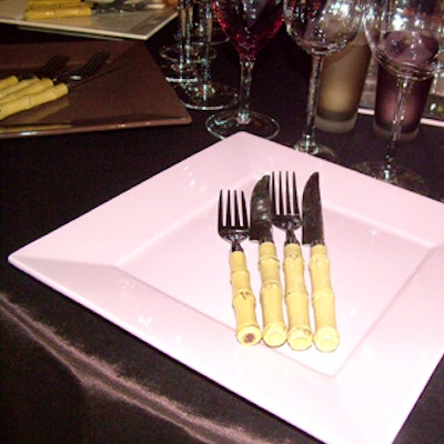 At the David Beahm-designed club tables sponsored by various companies, bamboo-handled utensils from Party Rental sat atop the plates.