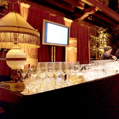 Behind the well-stocked bars, flat-panel video screens showed awards highlights.