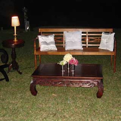 Behind the tent, a furniture grouping added to the charm of the Great Gatsby-themed evening.