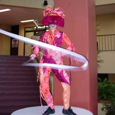 A ribbon dancer performed with flair.