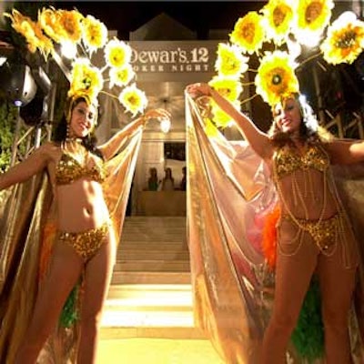 Entertainers dressed as Vegas showgirls welcomed guests to the Gables Estates mansion.