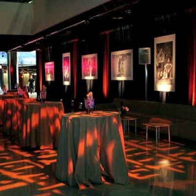 Black-and-white blowups of Miramax films decked the gray fabric-covered walls.