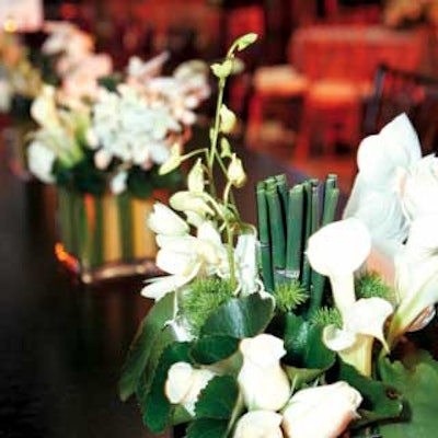 Arrangements of white roses and lilies gave the space a clean look.