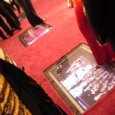 Video screens set into the red carpet played awards ceremony highlights.