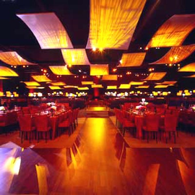 Fabric ceiling panels lit from above cast an amber glow.