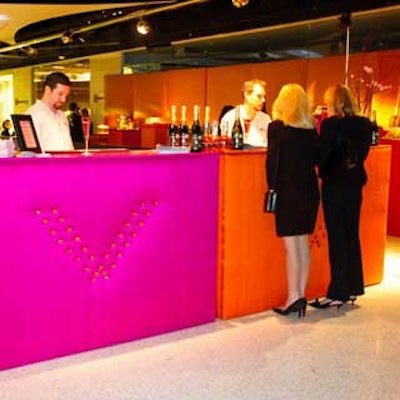 For its showroom opening at L.A.'s Pacific Design Center, Wildflower Linen covered Haute Bar Wear-designed bars in bright orange and pink fabrics.