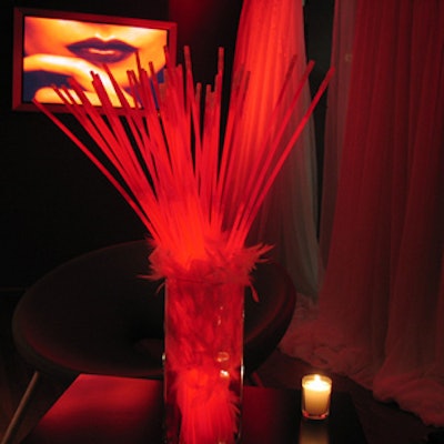 Event planners from Segal Communications provided centerpieces of red glowsticks and white feathers throughout the space to suit the red and white colour scheme.