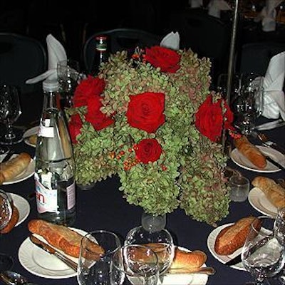 Centerpieces at the Empire State Pride Agenda dinner featured red roses and light green hydrangea by Gregory Bach Design.>