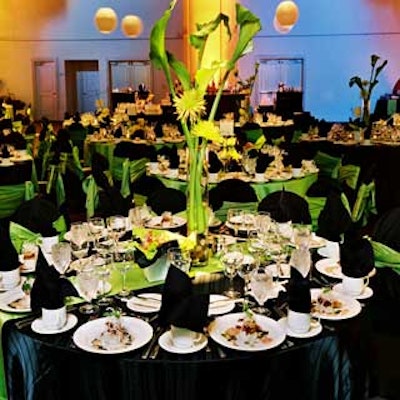 Tables were dressed in lime green and black linens and topped with clear vases filled with green flowers and river rocks.