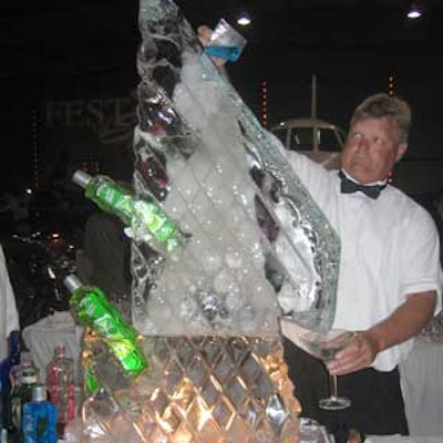 A bartender from Orange Blossom Catering whipped up a martini by sending the liquor through an ice luge in the sculpture.