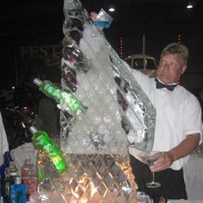 A bartender from Orange Blossom Catering whipped up a martini by sending the liquor through an ice luge in the sculpture.