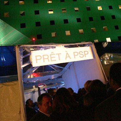 Guests gathered in an outside area near a tent adjoining the Pacific Design Center.