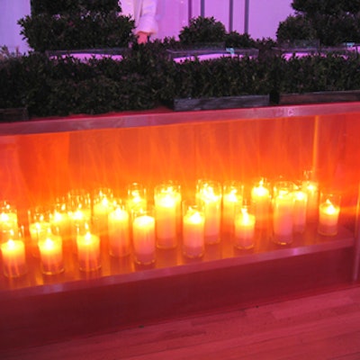 Caterer Rhonda Litwack created a unique atmosphere for its buffet station with pumpkin-coloured organza on the table's exterior and lots of flickering candles below.